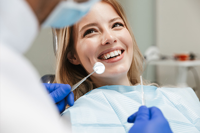 a dentist in modesto ca treating a patient