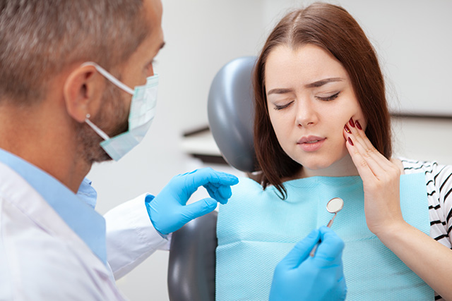 a patient seeking an emergency dentist dentist in modesto ca