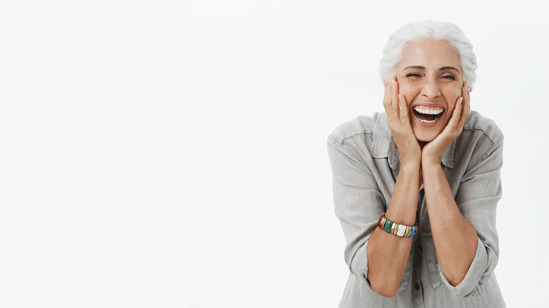 a middle aged lady surprised and happy with the deal she got with full mouth dental implants in modesto