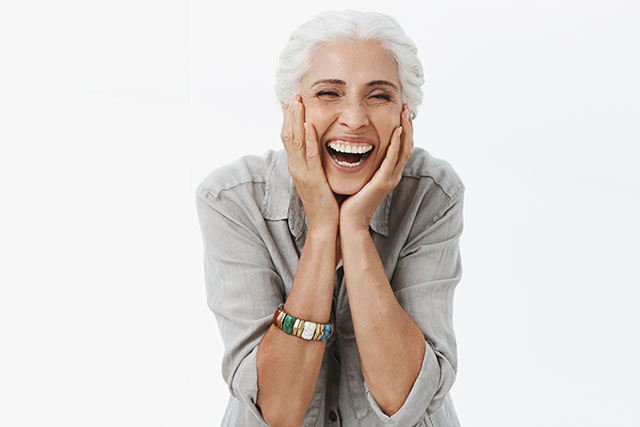 a surprised woman looking at our dentist near tracy ca